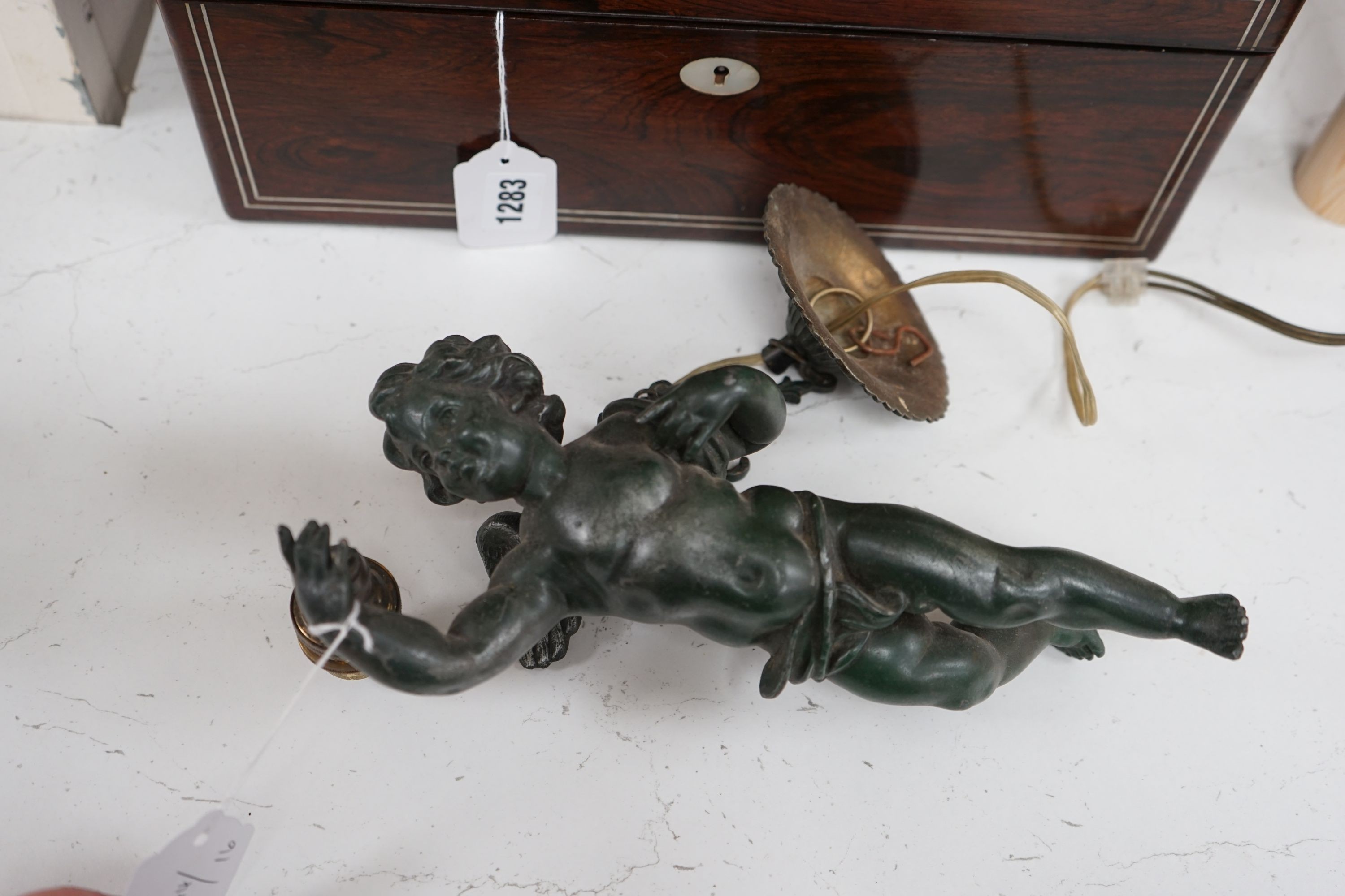 A bronzed spelter putti hanging light